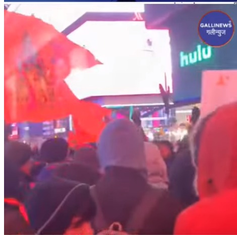Devotees celebrate with saffron flag and Indian flag at the famous Time Square in New York-