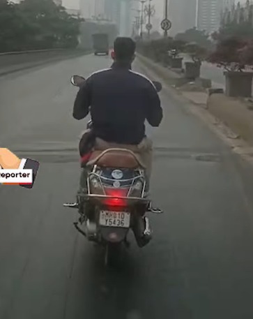 Lalbaug bridge … While driving police man not wearing a helmet