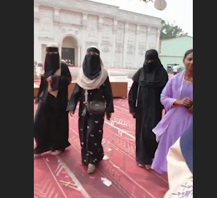 A Woman alleges that she went to a wedding ceremony to apply mehndi, where she was asked to remove her hijab