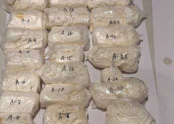 Cocaine tucked into trolley bag handle, plastic supports; Ugandan flyer held at Ahmedabad airport